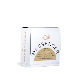 Colombia Gesha Cold Washed coffee in white Messenger packaging with gold label featuring specialty roast details